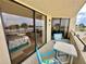 Private balcony overlooking water view; table and chairs included at 6009 Sea Ranch Dr # 214, Hudson, FL 34667