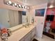 Bright bathroom with double vanity and updated fixtures at 6009 Sea Ranch Dr # 214, Hudson, FL 34667
