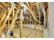 Unfinished attic space with exposed beams and insulation at 1005 Sonesta Ave, Brandon, FL 33511