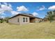 Spacious backyard with grassy lawn and covered patio at 1005 Sonesta Ave, Brandon, FL 33511