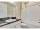 Bathroom with granite countertop, white cabinets and bathtub at 1005 Sonesta Ave, Brandon, FL 33511