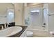 Clean bathroom with a tub shower, granite vanity, and white tile at 1005 Sonesta Ave, Brandon, FL 33511