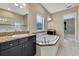 Bathroom boasts a garden tub, double sinks, and upgraded flooring at 1005 Sonesta Ave, Brandon, FL 33511