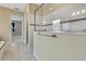 Bright bathroom with walk-in shower and glass enclosure at 1005 Sonesta Ave, Brandon, FL 33511