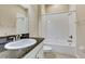Bathroom with granite countertop, white cabinets and bathtub at 1005 Sonesta Ave, Brandon, FL 33511