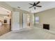 Spacious bedroom with carpet flooring, ceiling fan, and views to other rooms at 1005 Sonesta Ave, Brandon, FL 33511