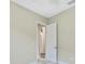 Bedroom with neutral walls and an open door to a hallway at 1005 Sonesta Ave, Brandon, FL 33511