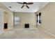 Well lit bedroom with carpet and access to a bathroom at 1005 Sonesta Ave, Brandon, FL 33511