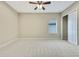 Bright bedroom featuring ceiling fan and window with blinds at 1005 Sonesta Ave, Brandon, FL 33511