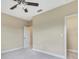 Bright bedroom with neutral walls, ceiling fan and carpet at 1005 Sonesta Ave, Brandon, FL 33511