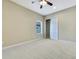 Bright bedroom featuring ceiling fan and window with blinds at 1005 Sonesta Ave, Brandon, FL 33511