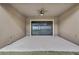 Covered patio with a sliding glass door and ceiling fan at 1005 Sonesta Ave, Brandon, FL 33511