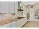 Bright kitchen with granite countertops, stainless steel appliances, and tile backsplash at 1005 Sonesta Ave, Brandon, FL 33511