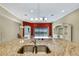 Kitchen with granite countertops, double sink, and view into Gathering room at 1005 Sonesta Ave, Brandon, FL 33511