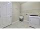 Convenient laundry room with washer, dryer, and utility sink at 1005 Sonesta Ave, Brandon, FL 33511