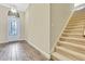 Elegant staircase with carpeted steps and neutral color palette at 1005 Sonesta Ave, Brandon, FL 33511