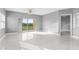 Bright living room with tile floors and sliding glass doors leading to a balcony at 2725 Terra Ceia Bay Blvd # 201, Palmetto, FL 34221