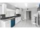 Modern kitchen with white cabinets, stainless steel appliances, and teal dishwasher at 2725 Terra Ceia Bay Blvd # 201, Palmetto, FL 34221