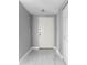 Bright entryway with white door and marble-look floors at 2725 Terra Ceia Bay Blvd # 201, Palmetto, FL 34221