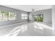 Spacious living room with grey walls, bright flooring, and sliding doors leading to a balcony at 2725 Terra Ceia Bay Blvd # 201, Palmetto, FL 34221