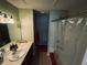 Bathroom includes vanity with extended countertop and shower and tub combo at 10453 Westpark Preserve Blvd, Tampa, FL 33625