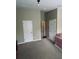 This large bedroom features neutral colored walls, carpeting, base molding, and has access to several closet spaces at 10453 Westpark Preserve Blvd, Tampa, FL 33625