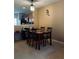 Dining room features modern light fixture and seating for four at 10453 Westpark Preserve Blvd, Tampa, FL 33625