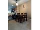 Dining room features modern light fixture and seating for four at 10453 Westpark Preserve Blvd, Tampa, FL 33625