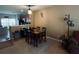 Open concept dining room with 4-seat dining table and view into the kitchen at 10453 Westpark Preserve Blvd, Tampa, FL 33625