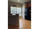 Bright kitchen features large window and tile flooring at 10453 Westpark Preserve Blvd, Tampa, FL 33625