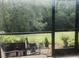View from the screened patio shows flourishing greenery at 10453 Westpark Preserve Blvd, Tampa, FL 33625