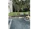 Landscaped entrance to the community with mature trees and a sidewalk at 10453 Westpark Preserve Blvd, Tampa, FL 33625