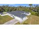 House with a gray roof and a two car garage at 18482 Holly Ave, Port Charlotte, FL 33948