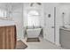 Modern bathroom featuring a freestanding soaking tub and updated fixtures at 18482 Holly Ave, Port Charlotte, FL 33948