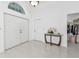 Bright and spacious entryway with tile floors and a console table at 18482 Holly Ave, Port Charlotte, FL 33948