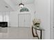 Clean and bright entryway with tile floor, console table, and closet at 18482 Holly Ave, Port Charlotte, FL 33948
