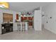Open kitchen features a breakfast bar and stainless steel appliances at 18482 Holly Ave, Port Charlotte, FL 33948