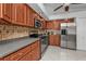 Kitchen with stainless steel appliances and wood cabinets at 18482 Holly Ave, Port Charlotte, FL 33948