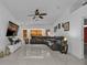 Living room with sectional sofa and large screen TV at 18482 Holly Ave, Port Charlotte, FL 33948