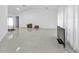 Spacious living area featuring tile floors and a large TV at 18482 Holly Ave, Port Charlotte, FL 33948