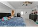 Bright main bedroom with king bed, ensuite bathroom access, and ample closet space at 18482 Holly Ave, Port Charlotte, FL 33948