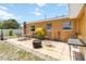 Backyard patio featuring an outdoor dining set and fire pit at 1801 40Th N St, St Petersburg, FL 33713