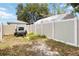 Fenced backyard with trailer, providing privacy and space for outdoor activities at 1801 40Th N St, St Petersburg, FL 33713