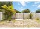 Landscaped backyard with stepping stones, decorative plants and a wooden fence, ideal for relaxation and privacy at 1801 40Th N St, St Petersburg, FL 33713