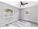 Bedroom features wood-look floors, dual windows and ceiling fan at 1801 40Th N St, St Petersburg, FL 33713