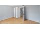 Neutral bedroom with light wood floors and an open closet entryway at 1801 40Th N St, St Petersburg, FL 33713