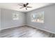 Bright bedroom with hardwood floors, neutral paint and natural light from two windows at 1801 40Th N St, St Petersburg, FL 33713