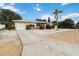 A single-story home features a well-manicured lawn, tidy landscaping, and a convenient single-car garage at 1801 40Th N St, St Petersburg, FL 33713