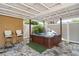 Outdoor hot tub area with stone flooring, privacy fence and an overhead roof at 1801 40Th N St, St Petersburg, FL 33713