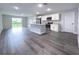 Open concept kitchen with island and stainless steel appliances at 13435 Kaplan Ter, Port Charlotte, FL 33981